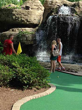 Guests Playing Miniature Golf