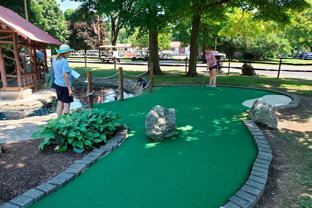 Guests Playing Miniature Golf
