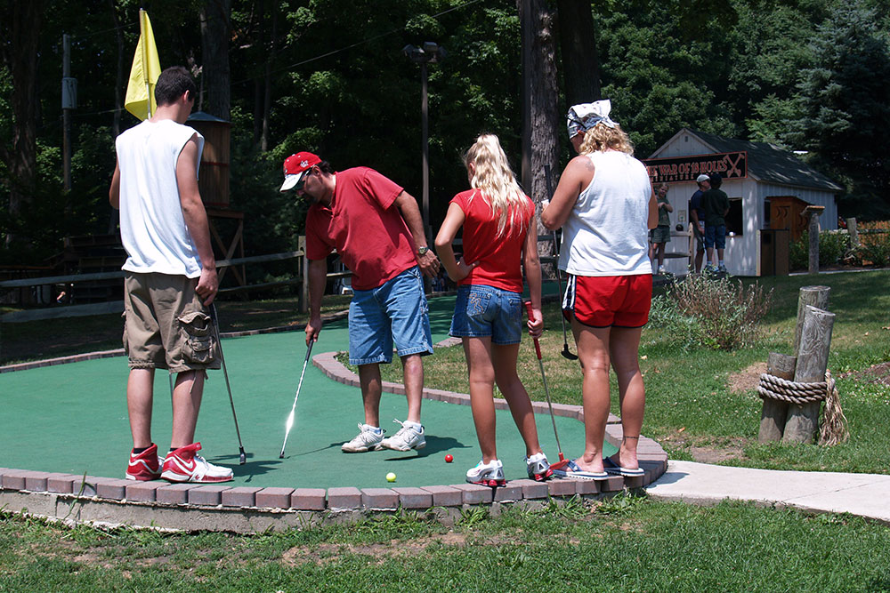 Guests Playing Miniature Golf