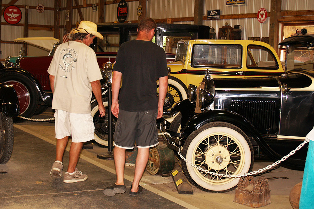 Guests Look at Cars In The Antique Car Museum